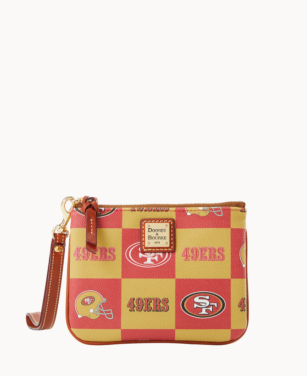 A small wristlet purse with a red and yellow checkerboard pattern featuring the San Francisco 49ers logos and the word 49ERS printed throughout. The purse has a brown leather strap and gold hardware.