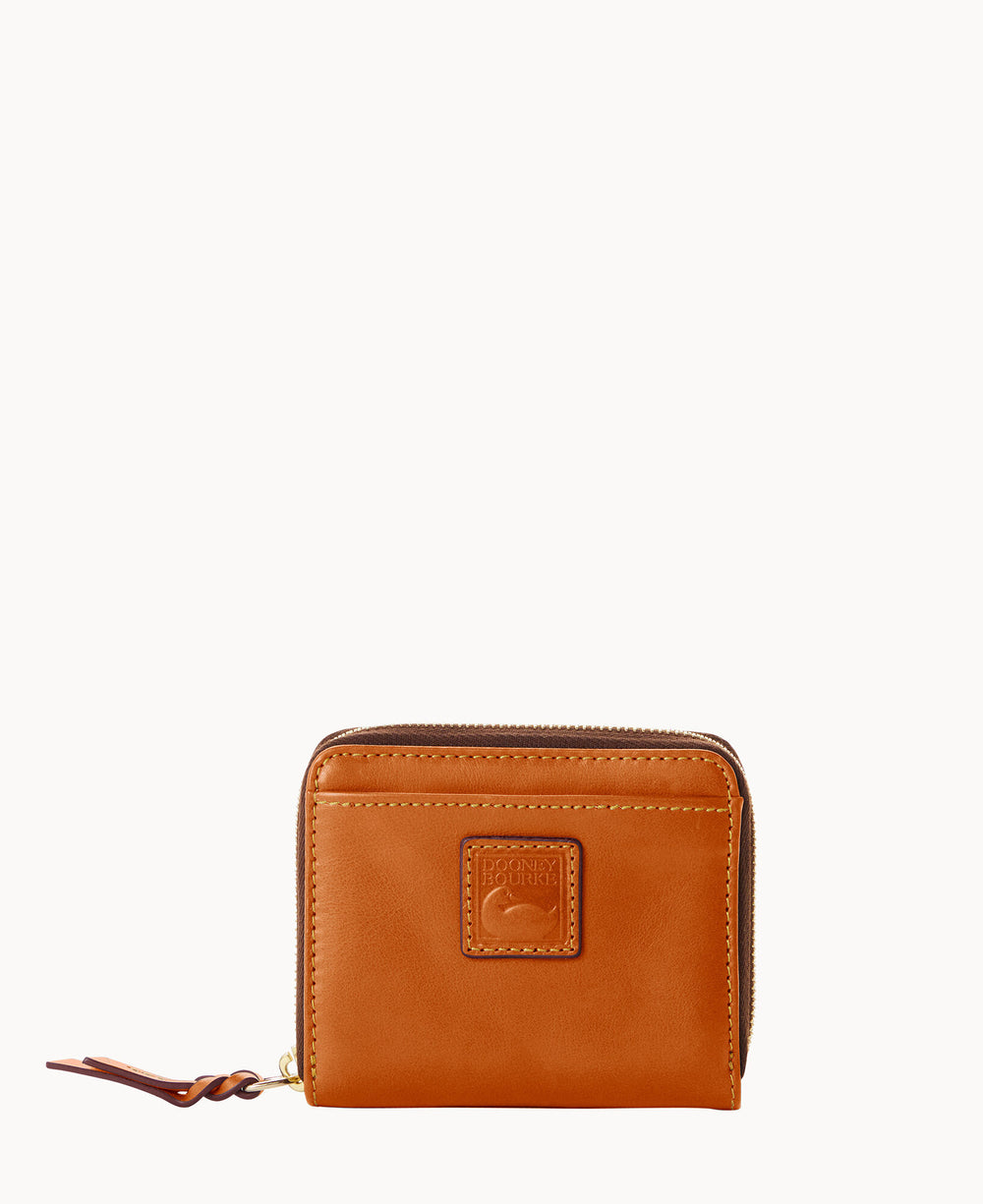 A small, square, light brown leather wallet with a zipper closure, a stitched front pocket, and an embossed logo patch in the center. The zipper pull is made of matching leather.