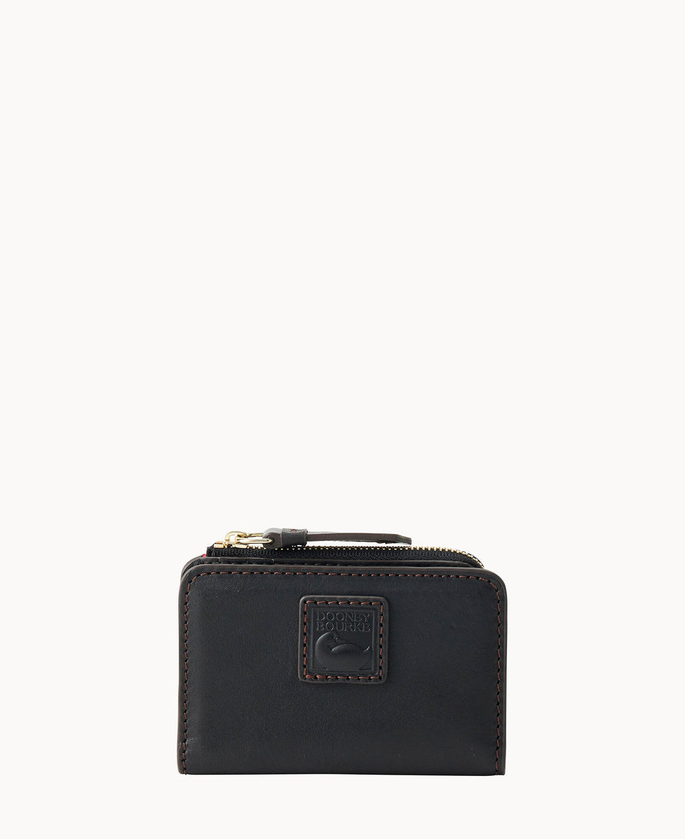 A small, black leather zippered wallet with a stitched border and an embossed logo patch on the front, set against a white background.