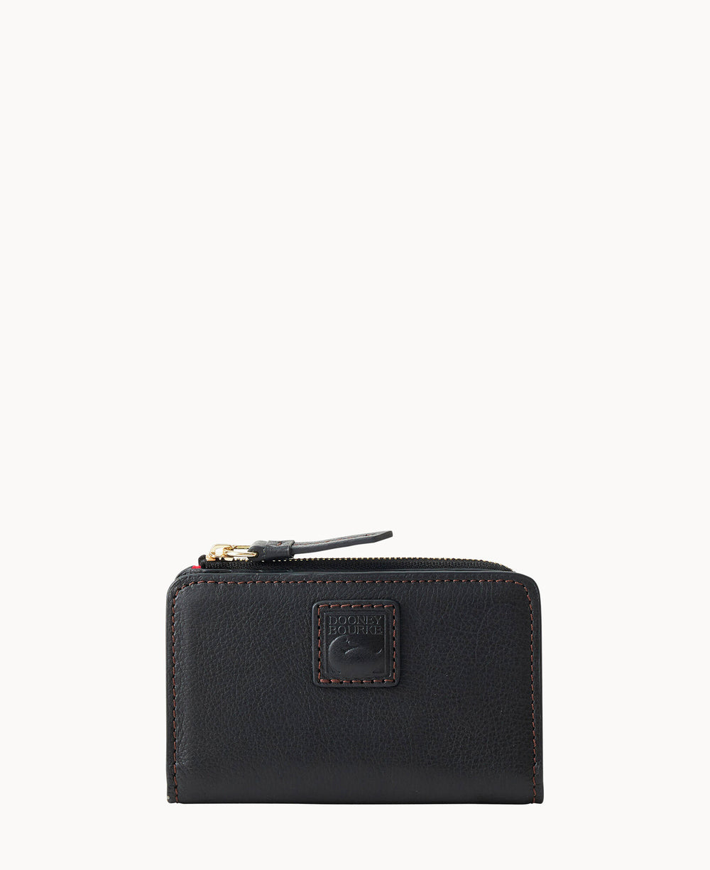 A small black leather wallet with a zipper on top, brown stitching, and a Dooney & Bourke logo patch on the front, displayed against a plain white background.