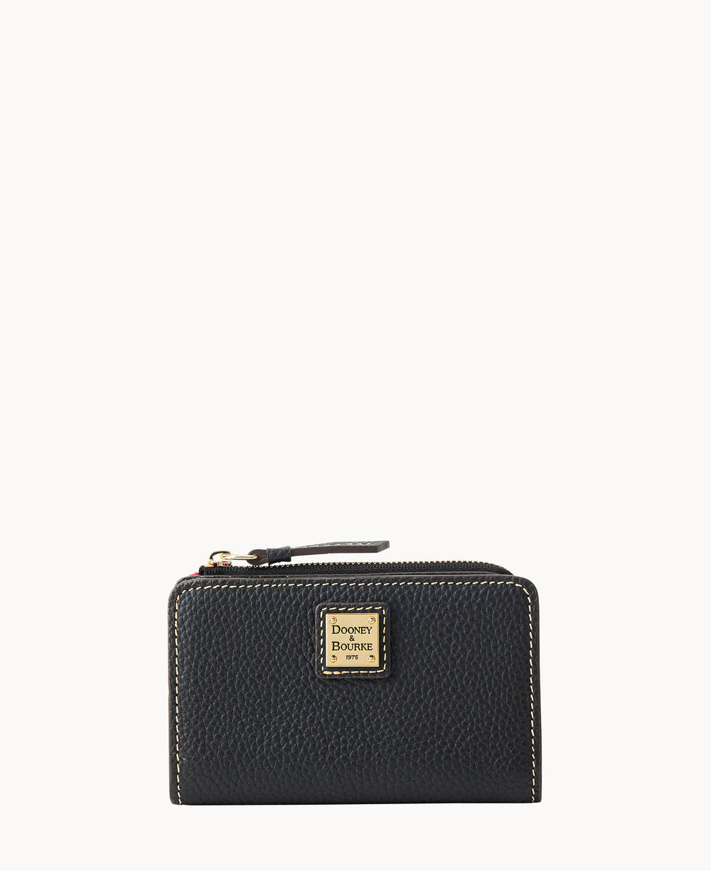 A black textured leather wallet with a zippered top and a gold square Dooney & Bourke logo plate on the front, displayed against a plain white background.