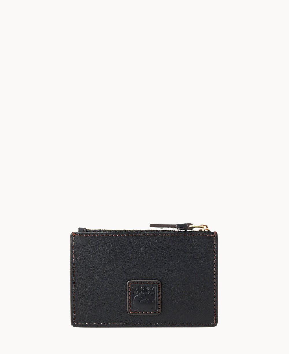 A small, black leather zippered card holder with brown stitching and a square embossed logo patch on the front. The zipper has a dark pull tab, and the background is plain white.