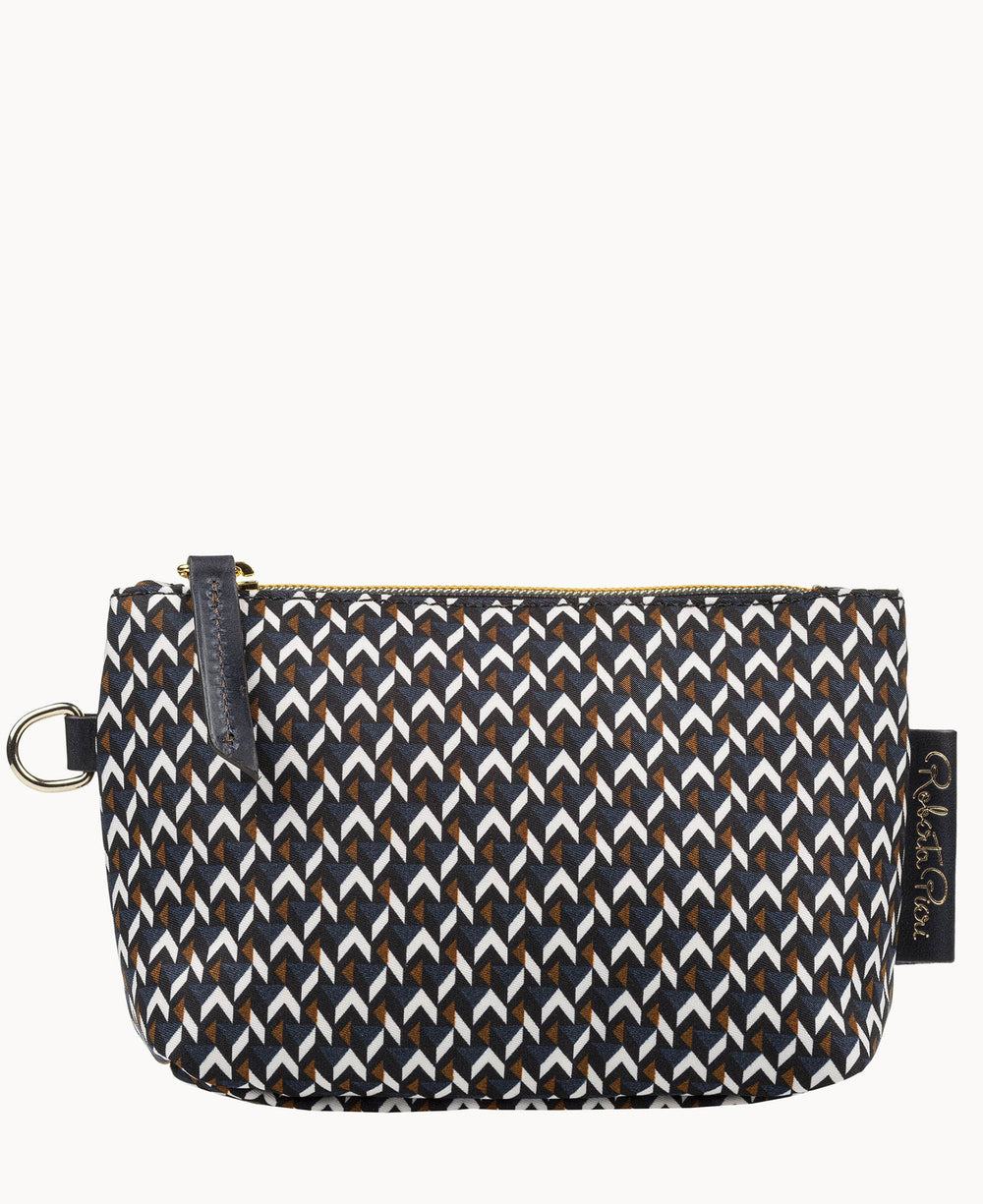 A small pouch with a black zipper and a geometric pattern of white, brown, and black arrows. The pouch has a side ring and a black fabric label.