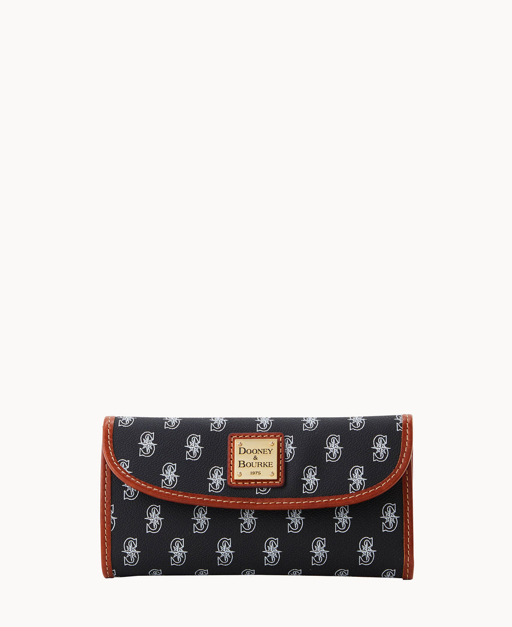 A black Dooney & Bourke wallet with a repeating white â€œDBâ€ logo pattern, brown trim, and a tan leather patch displaying the brand name on the front. The wallet is closed and photographed against a white background.