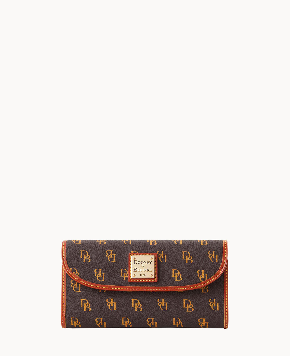 A brown Dooney & Bourke wallet with a gold logo plate and repeating DB monogram pattern, detailed with orange stitching and trim, set against a plain white background.