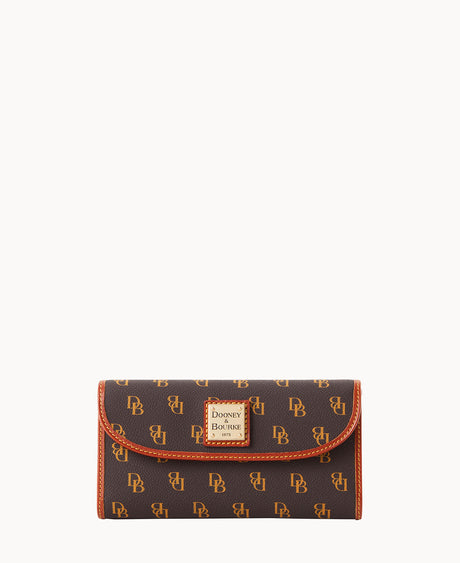 A brown Dooney & Bourke wallet with a gold logo plate and repeating DB monogram pattern, detailed with orange stitching and trim, set against a plain white background.