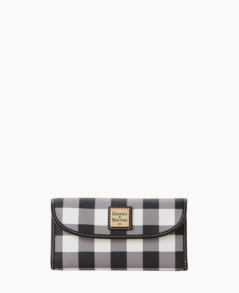 A black and white checkered wallet with a gold and white Dooney & Bourke logo plate on the front, set against a plain white background.