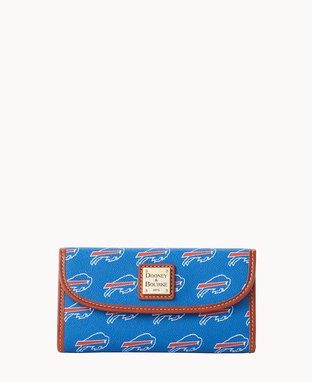A blue wallet with brown trim featuring a repeating white and red buffalo logo pattern and a gold Dooney & Bourke label on the front.