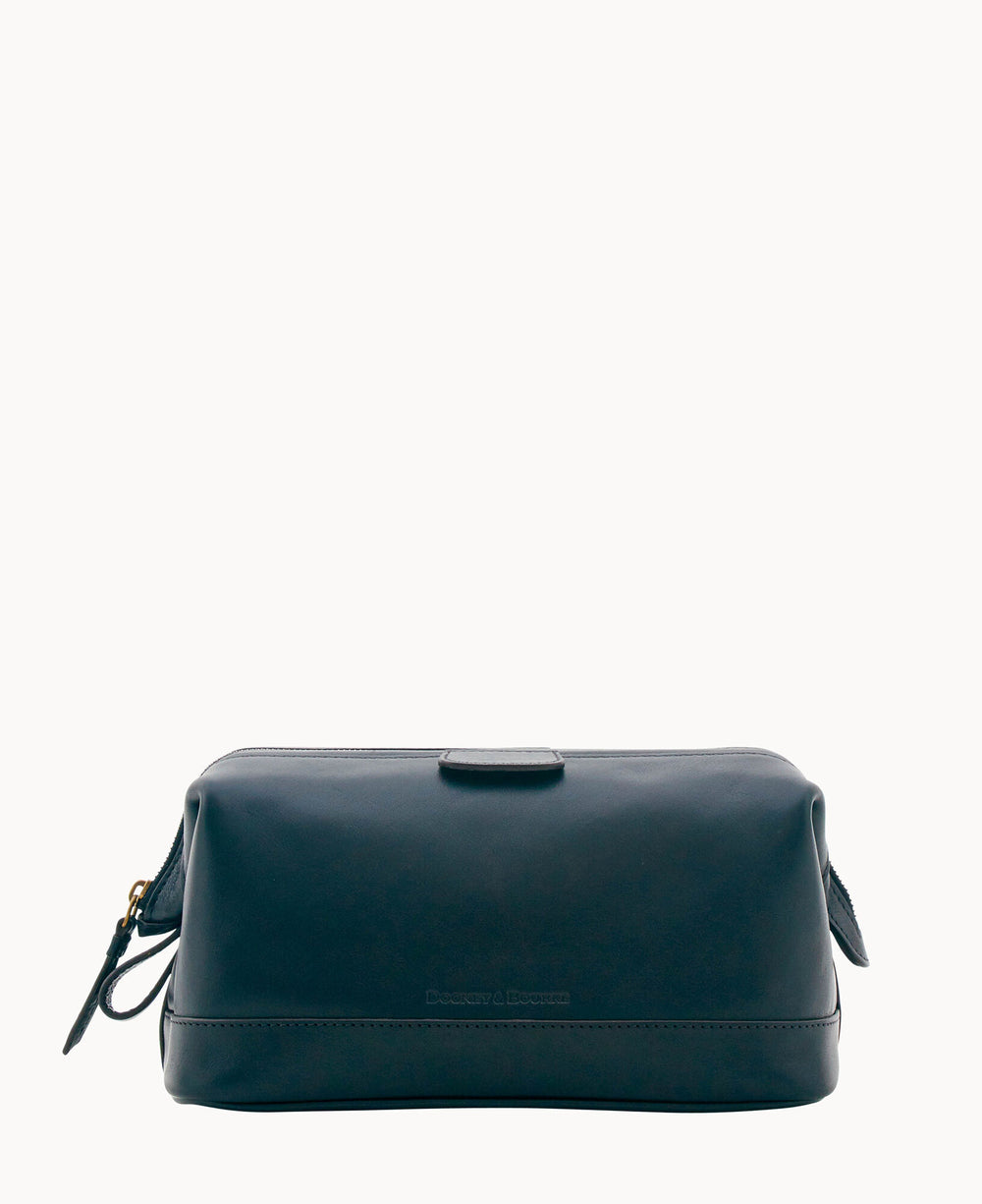 A rectangular dark leather toiletry bag with a top zipper and a small strap on one side, set against a plain white background.