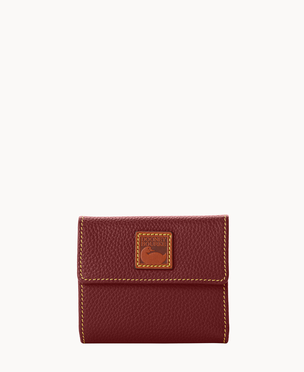A small, textured burgundy leather wallet with yellow stitching and a rectangular leather logo patch on the front.