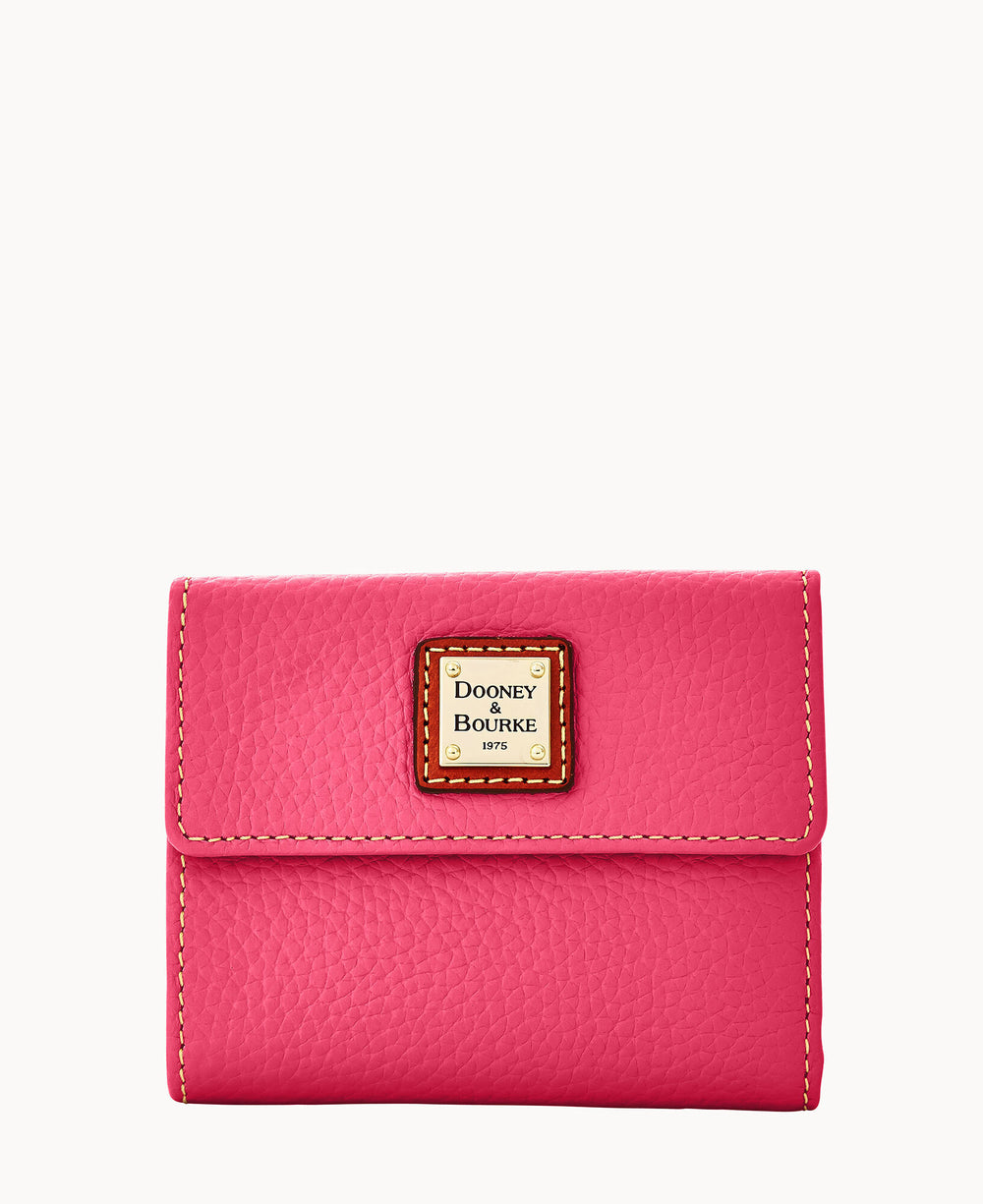 A bright pink leather wallet with a textured finish, yellow stitching, and a front flap featuring a square Dooney & Bourke logo patch.