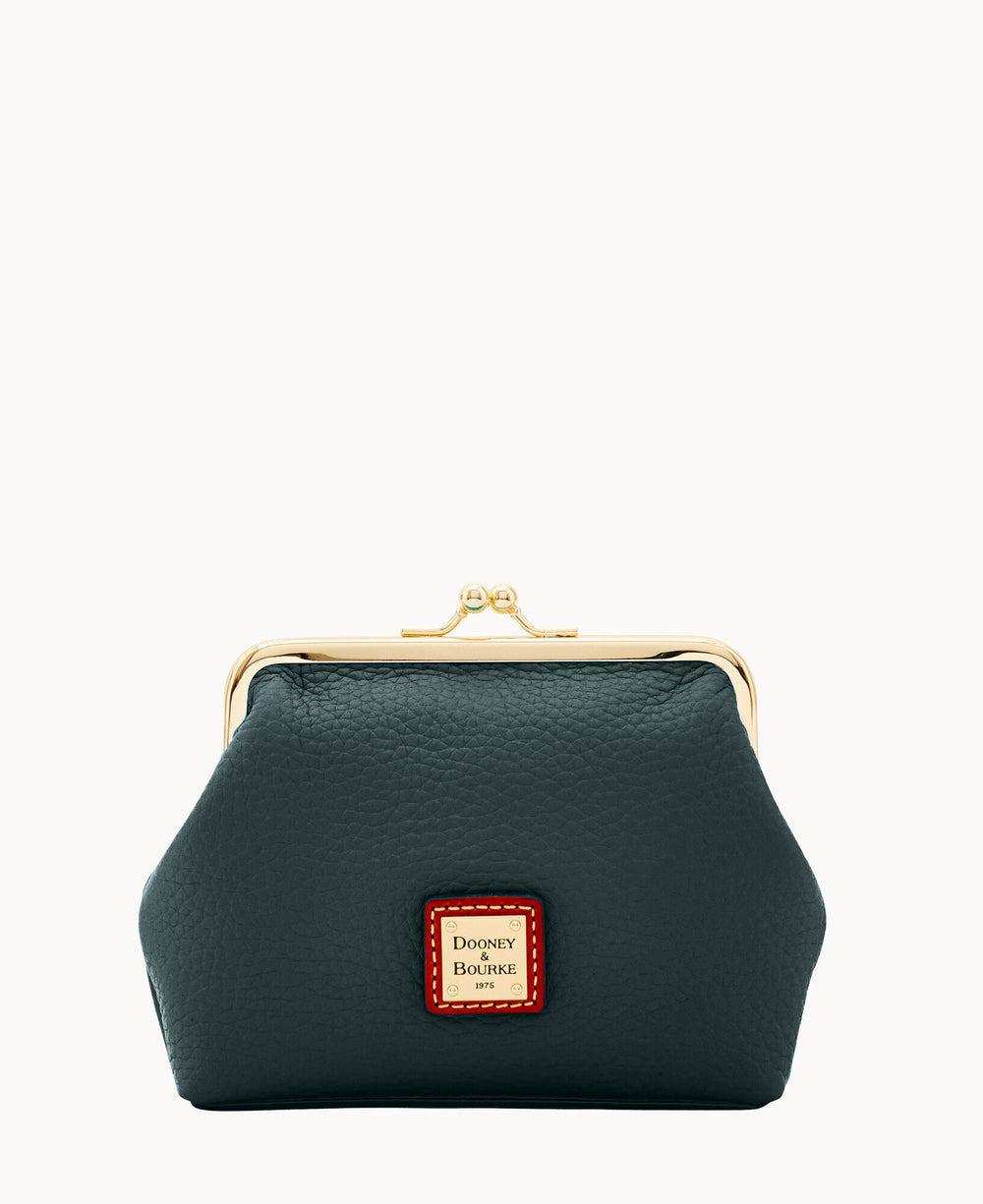 A dark green leather coin purse with a gold clasp and a small rectangular Dooney & Bourke logo patch on the front center.