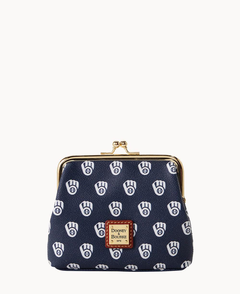 A navy blue coin purse with white Milwaukee Brewers logos, a gold clasp closure, and a brown Dooney & Bourke label on the front.