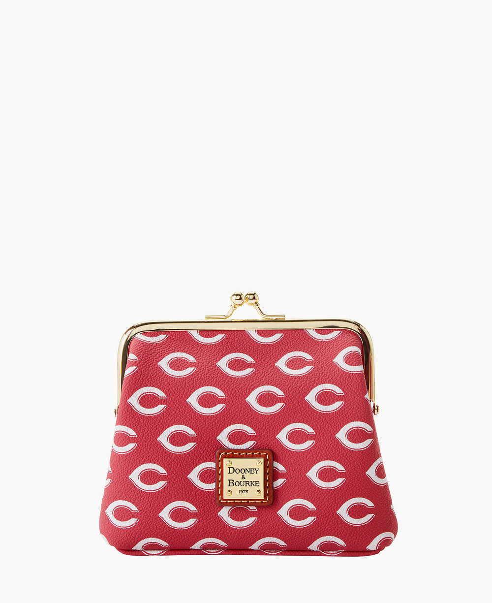 Red coin purse with a gold clasp, featuring a repeating white C pattern and a gold Dooney & Bourke logo plate on the front.